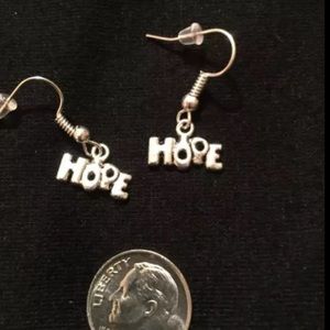 Silver tone "Hope" earrings. 2/$10
